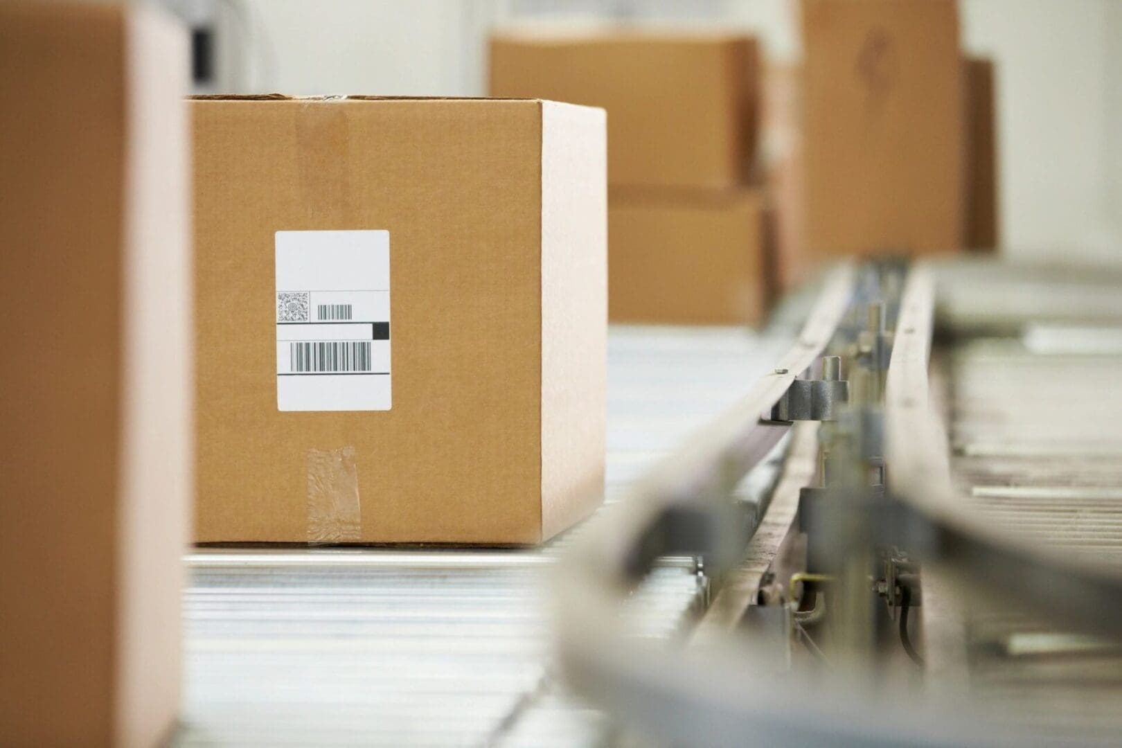 A box on the conveyor belt in an industrial setting.